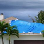 Photo-of-a-damaged-roof-with-tarp-may16.jpg